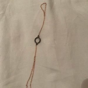 Rose gold bracelet and ring attached